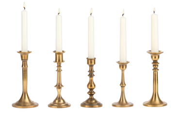 Five ornate brass candle holders with lit taper candles on transparent background
