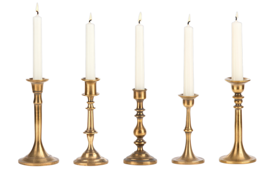 Five ornate brass candle holders with lit taper candles on transparent background