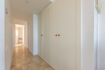 an image of white fitted wardrobes in master bedroom of holiday apartment 