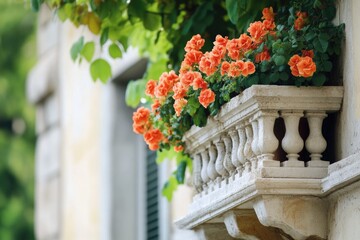 A planter filled with vibrant orange flowers sitting next to a building