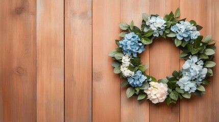 Elegant Floral Wreath with Blue and White Flowers on Wooden Background