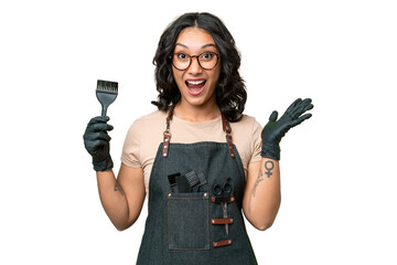Young argentinian hairdresser woman over isolated background with shocked facial expression