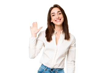 Young caucasian woman over isolated chroma key background saluting with hand with happy expression