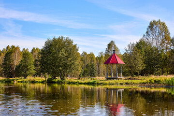 Tranquil Waterfront Gazebo on Sunny Day
