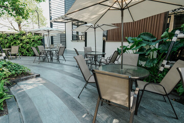 empty outdoor patio table and chair with umbrella