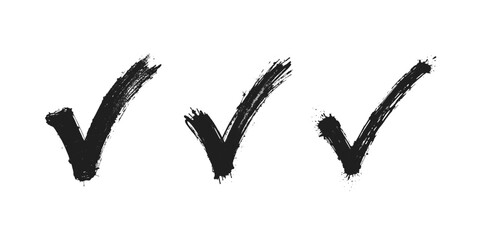 Black grunge check marks with rough edges and splatters