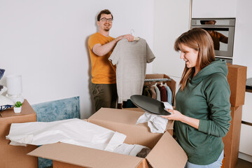Couple Actively Unpacking and Organizing Their New Home