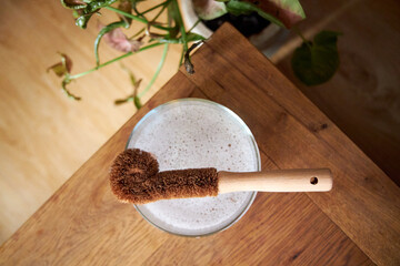 Removing coffee and lipstick stains from a white shirt with eco-friendly products, top view