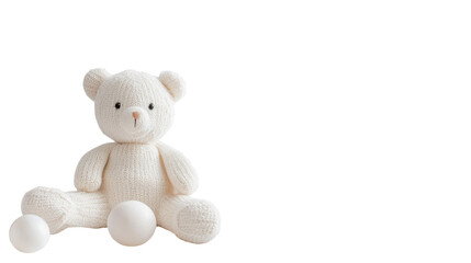 Soft white teddy bear with textured fabric and two white balls on a simple background enhancing childlike charm