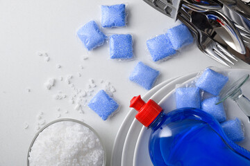 Detail of dishwasher products on white table