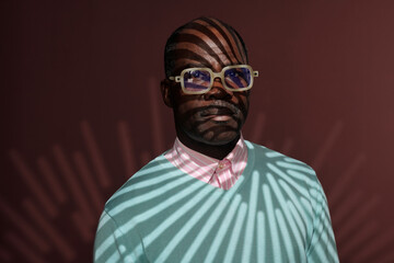 Portrait of Man With Unique Patterned Light Reflection