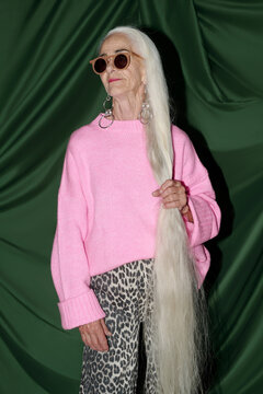 Fashion Statement Showcasing Long Hair and Stylish Pink Sweater