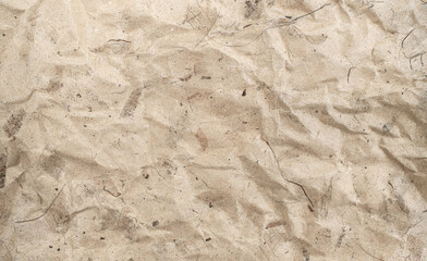 Recycle paper texture from natural leaf scraps. Crumpled brown paper texture background