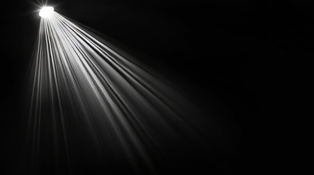 Glowing lens flare effect against a black background. Easily incorporate as an overlay or screen filter onto images