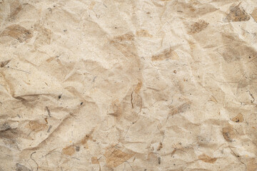 Recycle paper texture from natural leaf scraps. Crumpled brown paper texture background