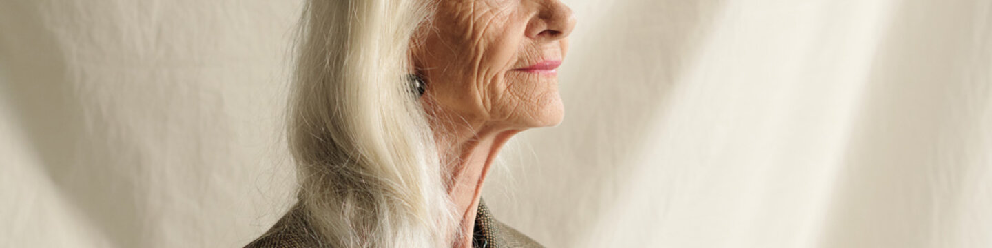 Side View of Elderly Woman with Long White Hair
