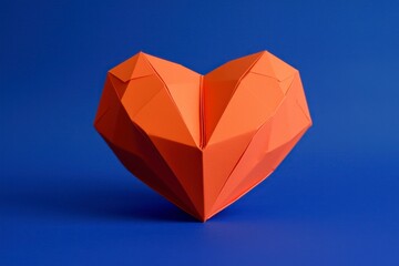 Orange Paper Heart Sculpture on Blue Background for Romantic Themes