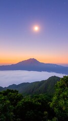 Majestic Mountain Landscape with a Full Moon and Colorful Sunset Over a Cloudy Horizon