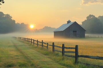Sunrise over a rustic farm with a wooden fence and misty fields