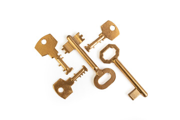 Five golden keys arranged isolated on white background