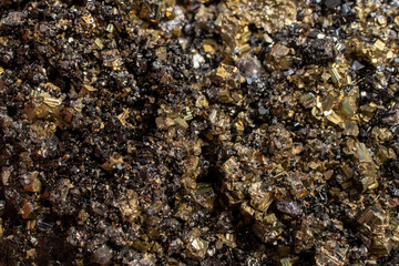 Pyrite mineral flower black and golden color soft focus close up, abstract pattern structure