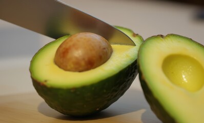 Sliced avocado revealing its seed