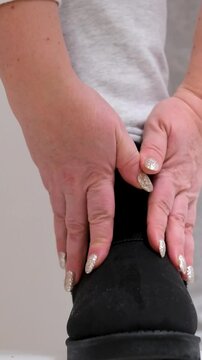 black ugg boots Static Cinematic video of a women wearing black formal shoes and walks