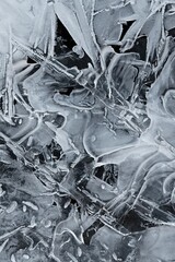 Frozen stream and ice closeup photo. Beautiful winter abstract background in nature. Concept for water and winter time.