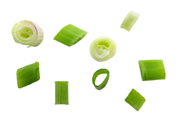 Falling green onion slices, fresh cut chives isolated on white background