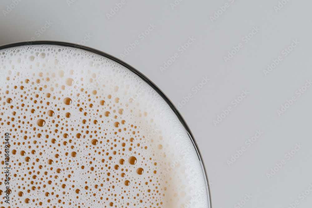 Poster bubbles of delight: a refreshing beer with a frothy head, offering a visual treat with its bubbly te