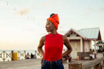 Confident garifuna woman wearing traditional orange headscarf in livingston, guatemala