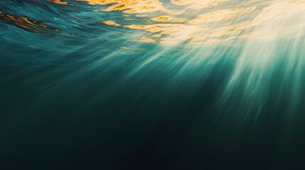 Captivating close up of turquoise and orange underwater abstract with cinematic motion blur shimmering light rays and dreamy depth of field at sunset