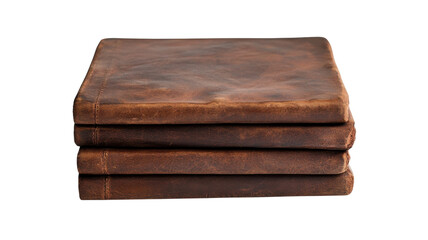 Obraz premium Handcrafted leather-bound journals stacked on a plain surface