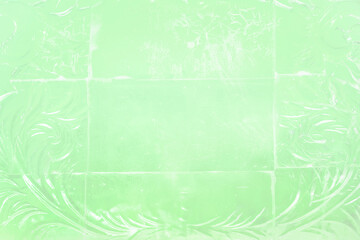 Green background of ice blocks wall Intricate and Frozen Decorative Patterns Adorning Glass Surfaces with a Deep Blue Background