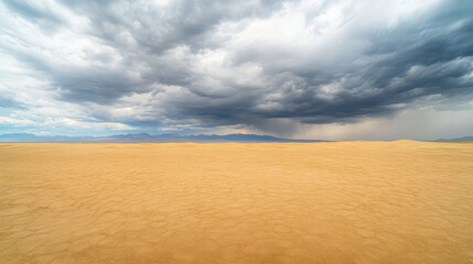 Naklejka premium panoramic view of vast desert landscape under dramatic clouds, showcasing expansive sandy terrain and distant mountains. scene evokes sense of solitude and natural beauty
