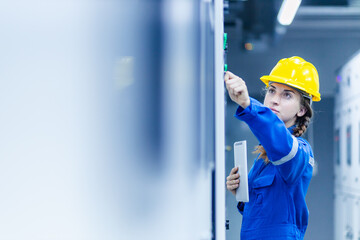 Construction workers in a warehouse wearing helmets and working on a building site