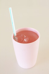 Drinking glass with straw at restaurant