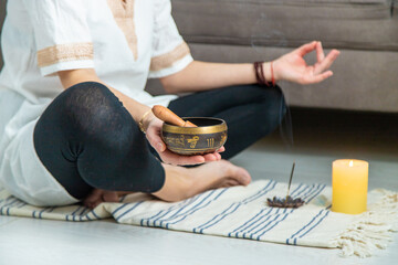 Woman doing yoga at home and aromatherapy. Selective focus.