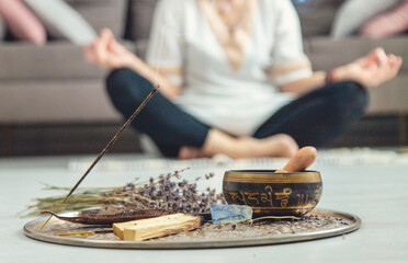 Woman doing yoga at home and aromatherapy. Selective focus.