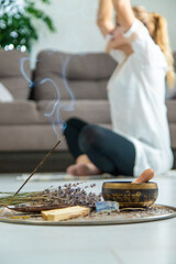 Woman doing yoga at home and aromatherapy. Selective focus.