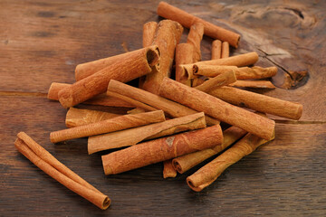 cinnamon sticks on rustic old wooden background     