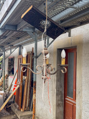 Naklejka premium Old Chandelier Hanging in Renovation Site