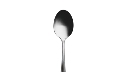Reflective metal spoon resting on a plain surface captures minimalistic elegance in contemporary design