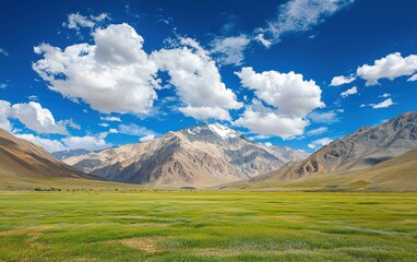 Fototapeta premium Professional stock photo of a scenic mountain landscape with a clear blue sky and fluffy clouds