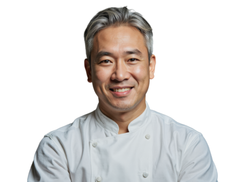 A smiling man wearing a white chef's uniform stands against a transparent background