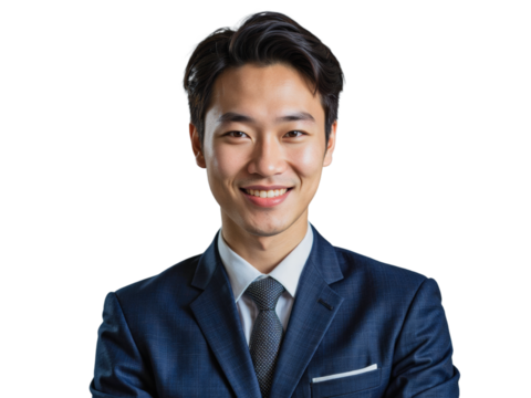 A young Asian man in a dark blue suit, white shirt, and patterned tie poses for a professional portrait in front of a plain, neutral background. - Powered by Adobe