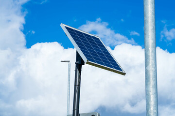 Obraz premium Single solar panel to power a street light, Solar panel cells powering a light pole