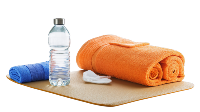 Orange and blue towels with water bottle on yoga mat for fitness and hydration