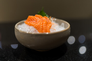Salmon raw slice of salmon sashimi in Japanese style fresh serve on ice. Asian Food menu. Seafood sashimi.