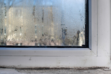a wet window. It's dripping with water